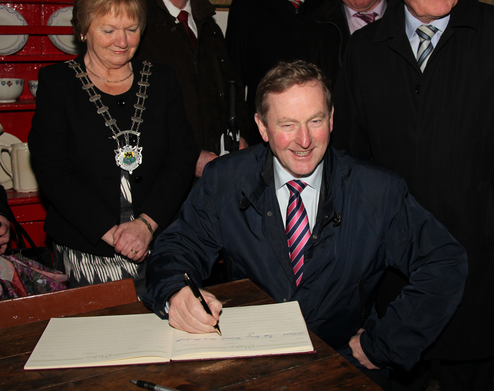 An Taoiseach Enda Kenny signing Visitors book in Sean Mac Diarmada's house